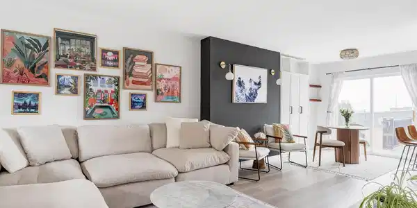 Image 3: This home has been brought forward through a thoughtful remodel that introduces a clean, modern palette with updated flooring throughout, including luxury vinyl on the main level and plush carpet above and below.