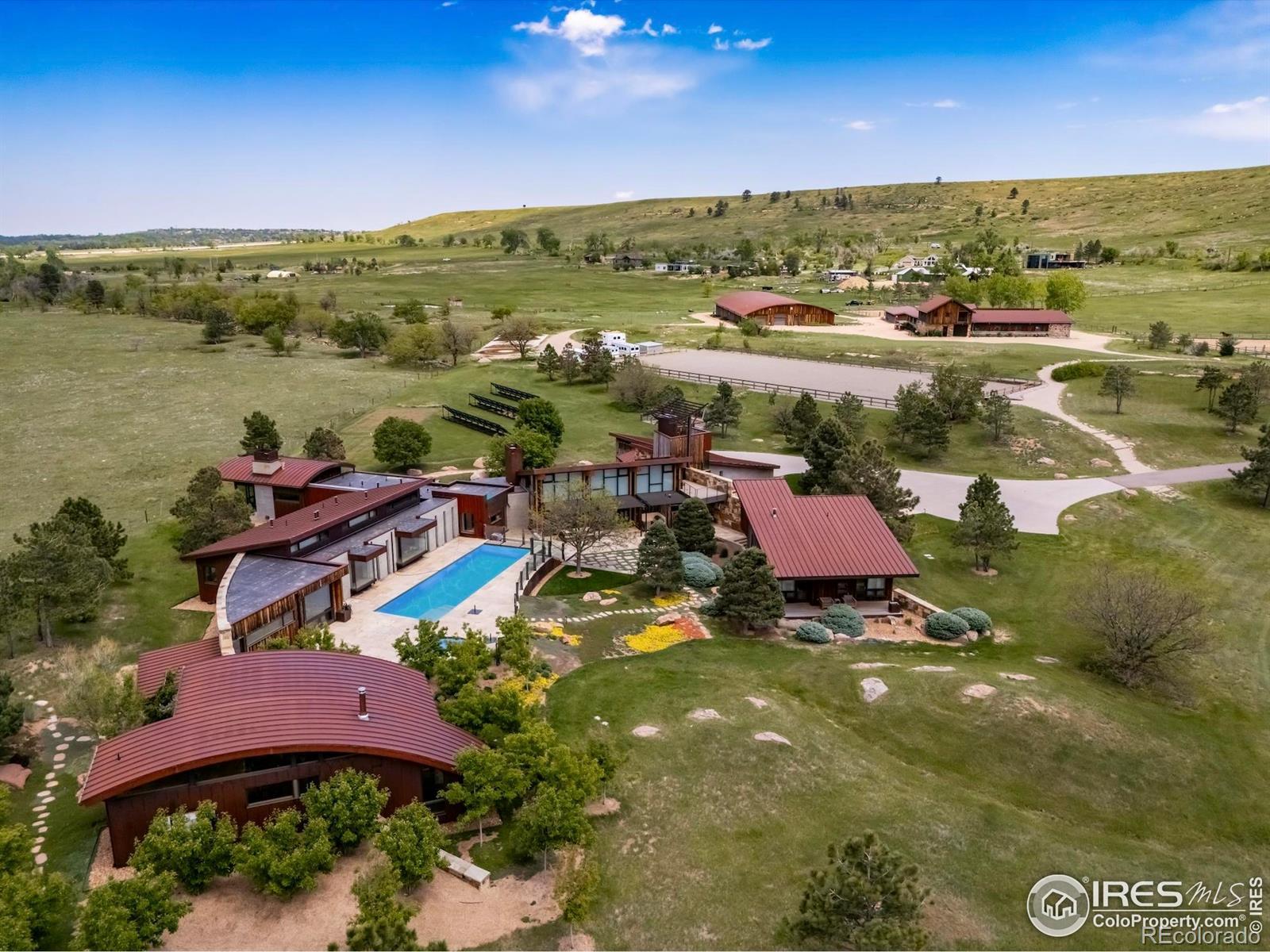 Image 3: Aerial view of residence from W