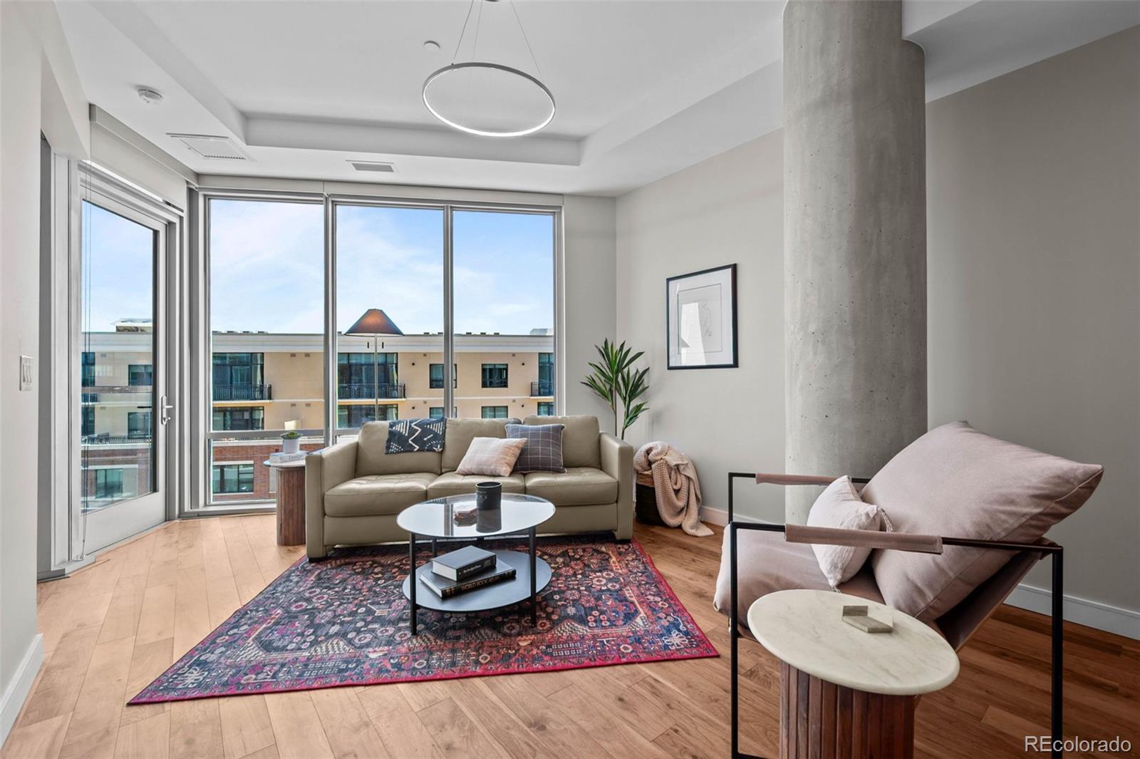 Image 1: Open floor plan, hardwood flooring, light and bright with floor to ceiling windows