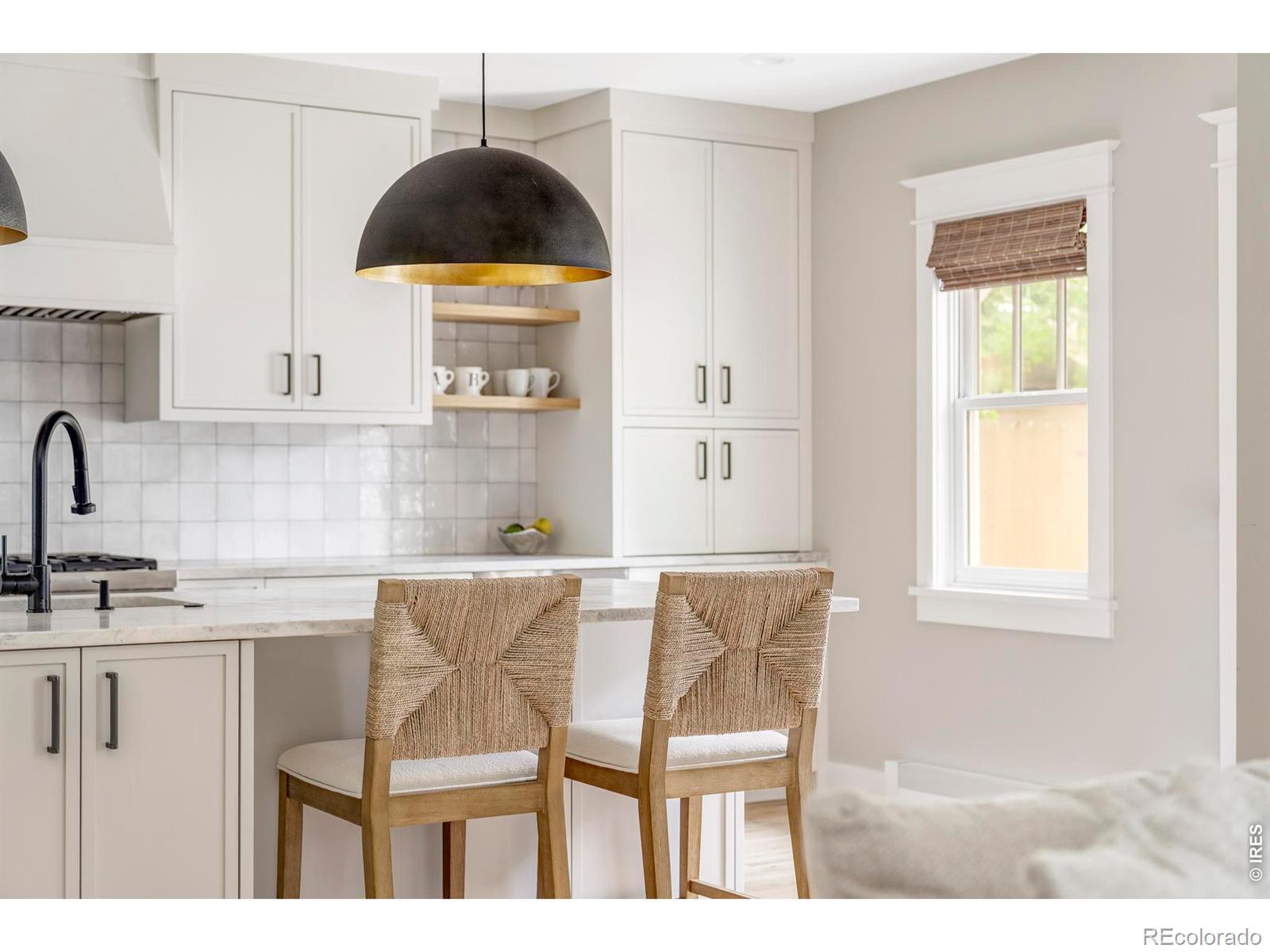 Image 4: Bar seating and generous storage make the island a natural hub for casual meals, conversation, and everyday routines. Image 4: Bar seating and generous storage make the island a natural hub for casual meals, conversation, and everyday routines.