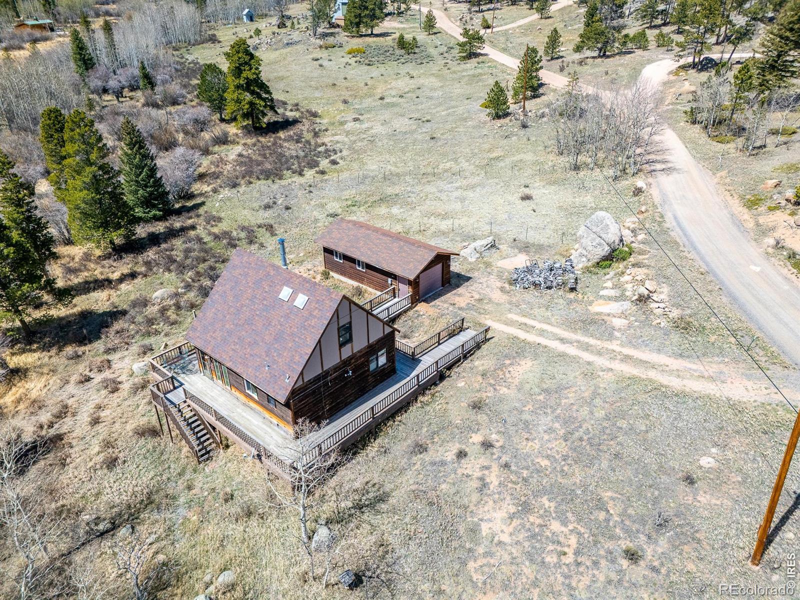 Image 2: Expansive wraparound deck offering multiple outdoor living areas