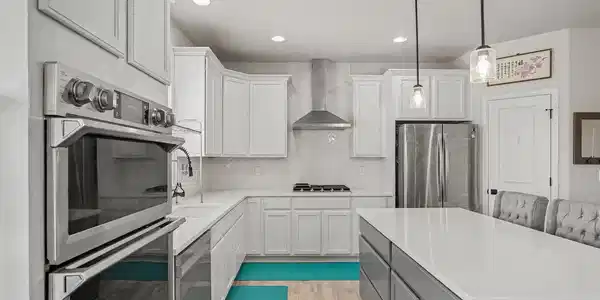 Image 3: Plenty of work space on the quartz countertops and island Image 3: Plenty of work space on the quartz countertops and island