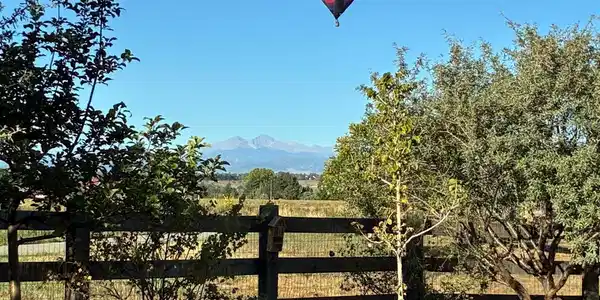 Image 3: View of Longs Peak from the back yard. Balloons are common to see. Image 3: View of Longs Peak from the back yard. Balloons are common to see.