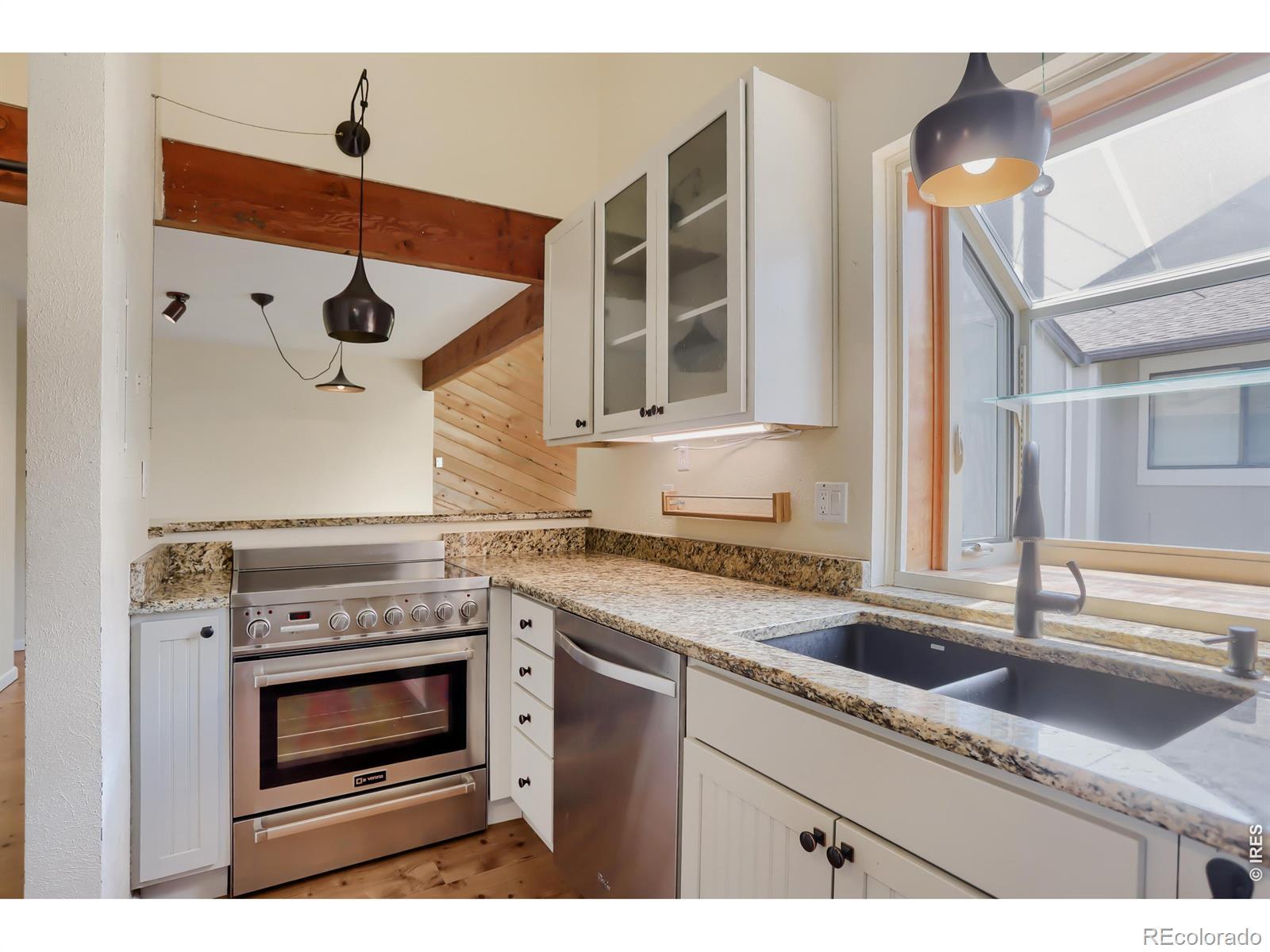 Image 4: Custom kitchen open to living/dining room Image 4: Custom kitchen open to living/dining room