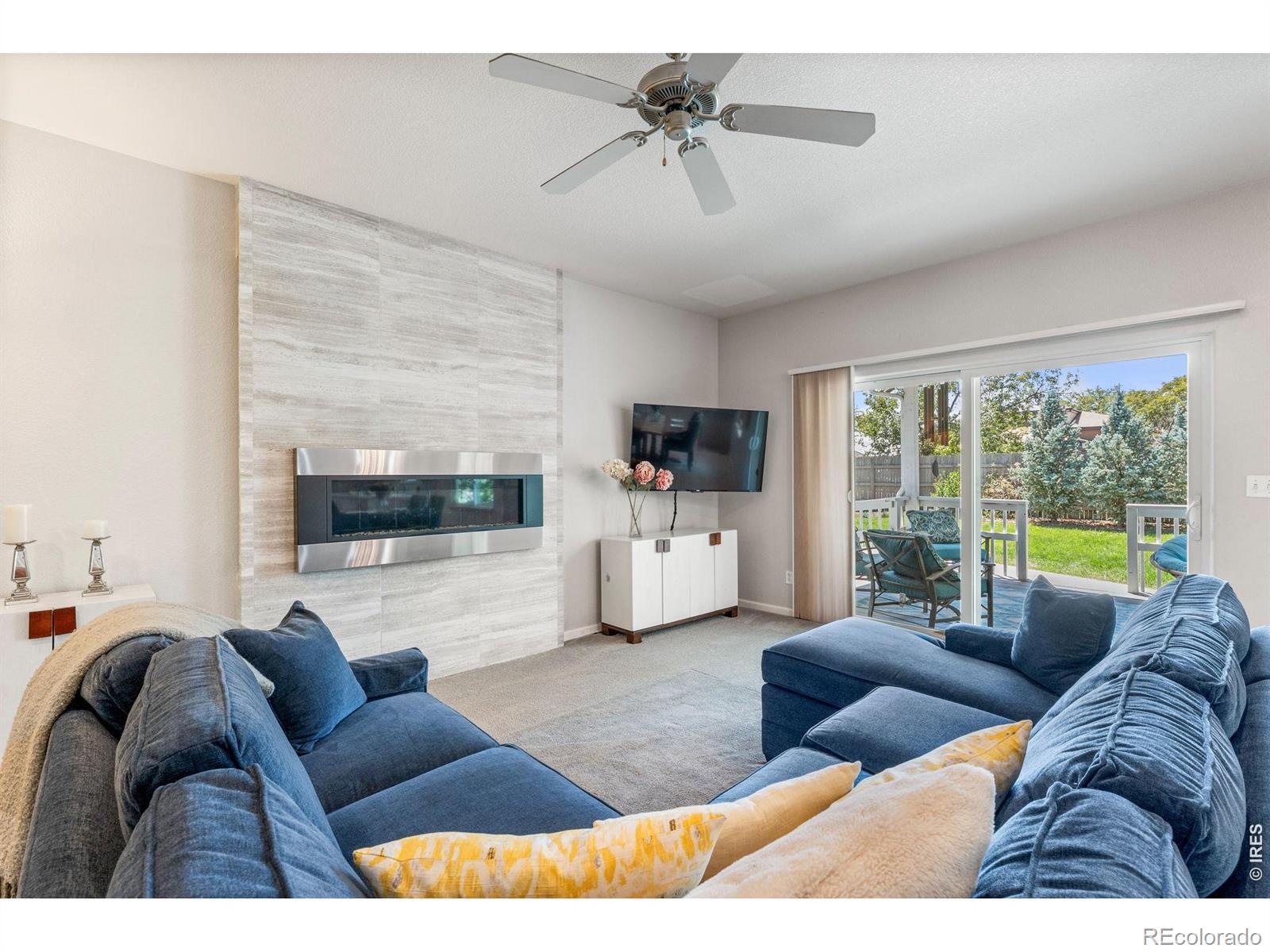 Image 4: Inviting living room with fireplace and easy access to outdoor living. Image 4: Inviting living room with fireplace and easy access to outdoor living.
