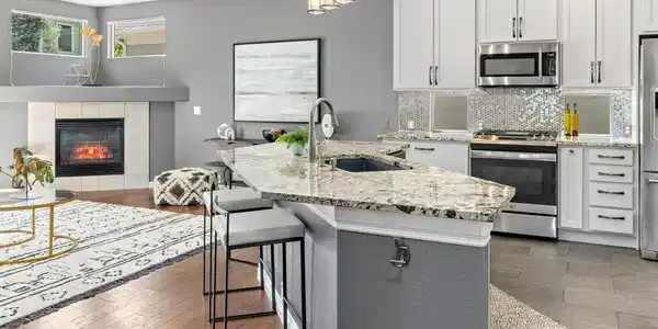 Image 3: The open-concept layout creates a seamless transition between the gourmet kitchen and the inviting living area, making it perfect for both daily living and entertaining. The fluid floor plan ensures that the chef stays connected Image 3: The open-concept layout creates a seamless transition between the gourmet kitchen and the inviting living area, making it perfect for both daily living and entertaining. The fluid floor plan ensures that the chef stays connected