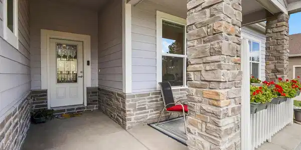 Image 3: Entrance located on a quite street, the front porch offers great views.