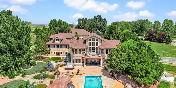 Image 3: Resort-inspired backyard featuring a swimming pool, hot tub, putting green, multiple outdoor entertaining areas and lush landscaping. Image 3: Resort-inspired backyard featuring a swimming pool, hot tub, putting green, multiple outdoor entertaining areas and lush landscaping.