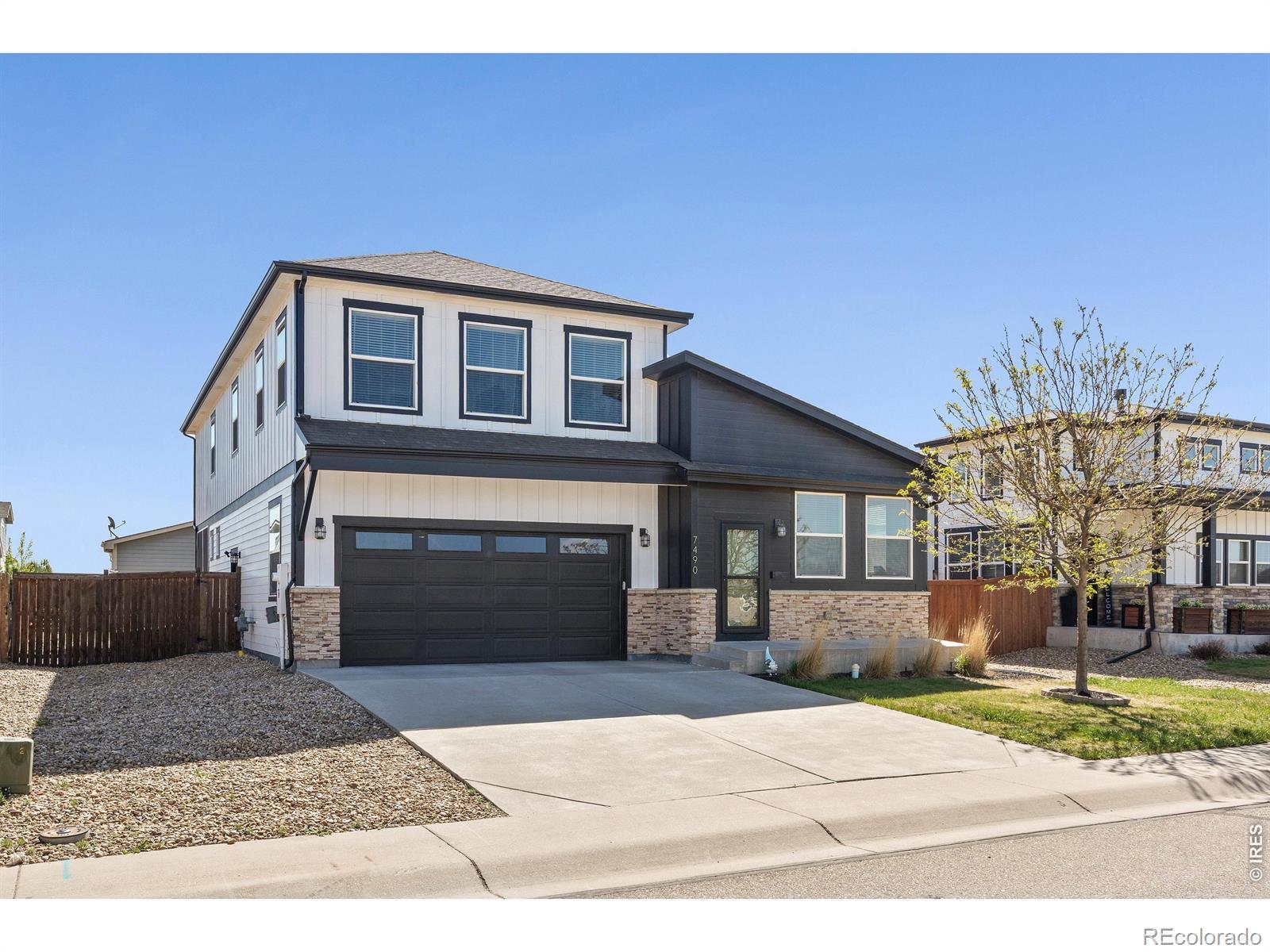 Image 3: West facing with mountain views. Longs Peak. Extended driveway width for additional space between cars. Image 3: West facing with mountain views. Longs Peak. Extended driveway width for additional space between cars.