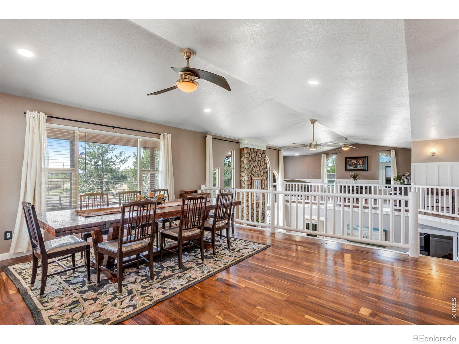 Image 3: As you walk into the home, the dining room is to your left with a large window giving you western views.