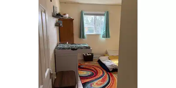 Image 4: Bad picture of main floor bedroom-has attached private bath