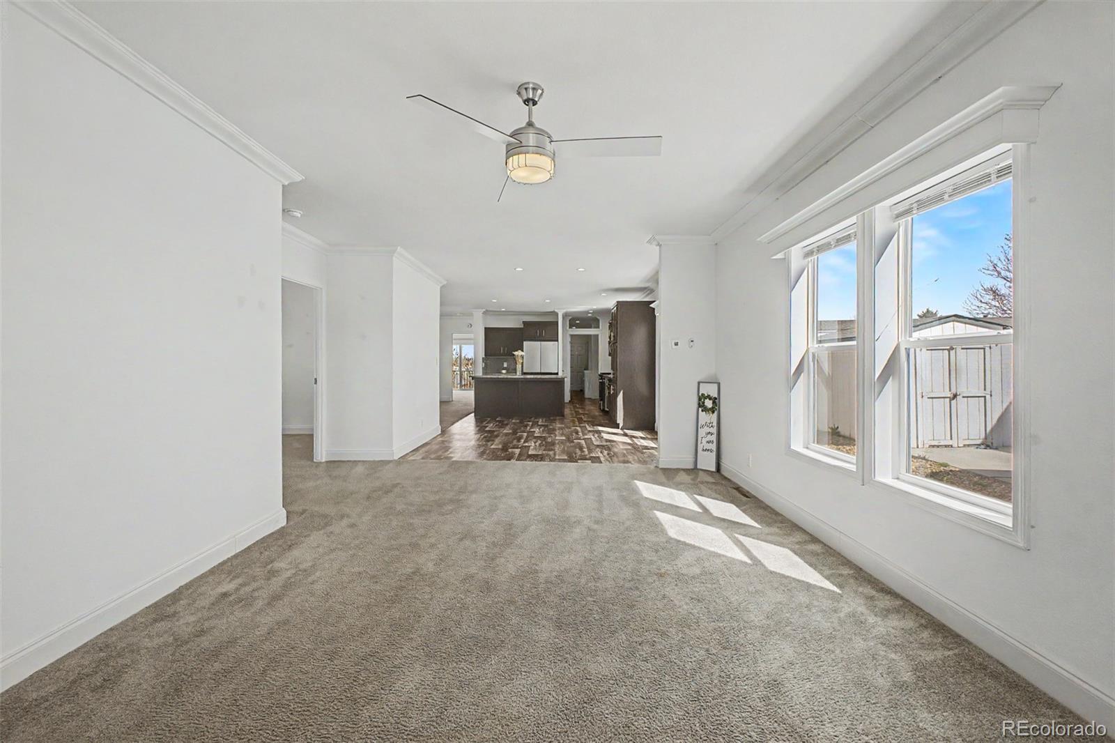 Image 4: Living Room opens to Kitchen/Dining Area Image 4: Living Room opens to Kitchen/Dining Area