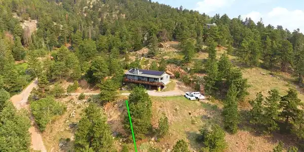 Image 4: South facing home and property extends to creek