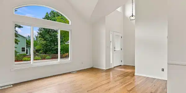 Image 2: Living Room with Vaulted Ceilings.