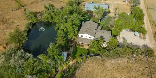 Image 3: The property from above - home, water, pasture, and shop.