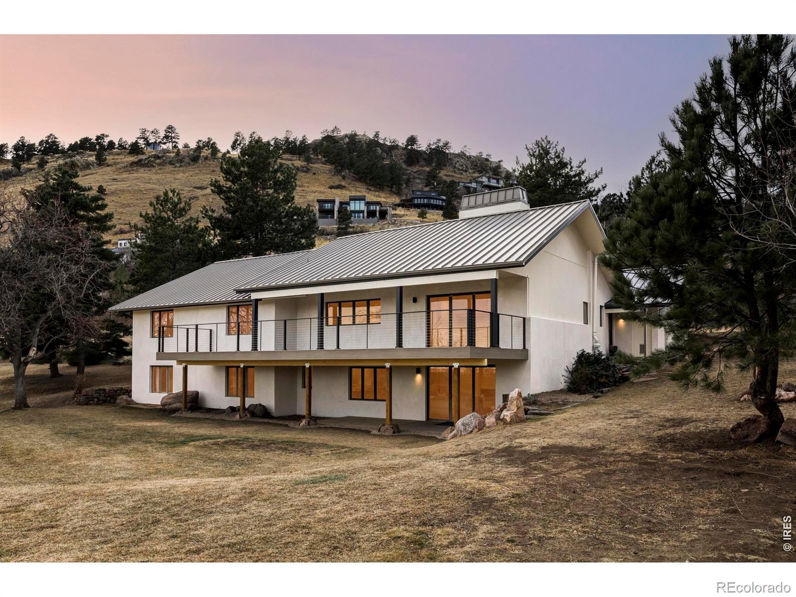 Image 2: 3735 Wild Plum Court sits on 0.7 acres at the edge of the city, on a quiet cul-de-sac where Boulder feels like its easing into the foothills.