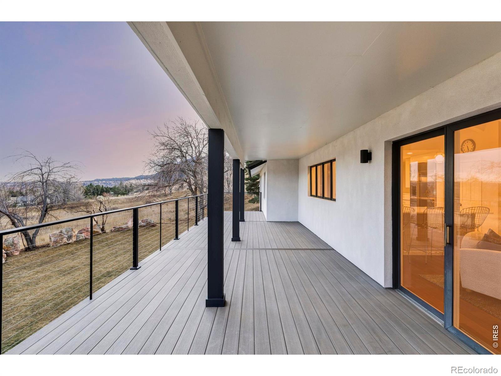 Image 3: Summer dinners overlooking the mountains and open space become a natural extension of daily life.