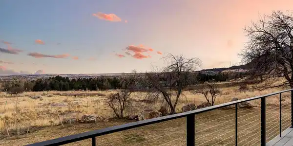 Image 4: The brand-new back deck is large, half-covered, and directly accessible from the family room. It overlooks a sweeping backyard that stretches to the edge of Open Space, where natural boulders and south-facing rock outcroppings mark the property line. Image 4: The brand-new back deck is large, half-covered, and directly accessible from the family room. It overlooks a sweeping backyard that stretches to the edge of Open Space, where natural boulders and south-facing rock outcroppings mark the property line.