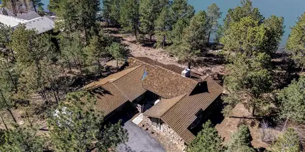 Image 3: Direct lakefront positioning in Lake of the Pines is exceptionally limited, and this lot holds one of the most sought-after placements in the community.