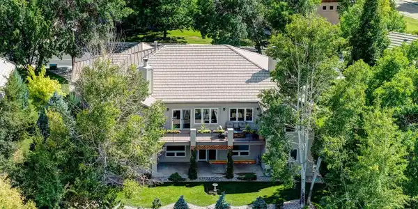 Image 3: Stunning view of the rear of the hone with stucco surround and tile roof. Image 3: Stunning view of the rear of the hone with stucco surround and tile roof.