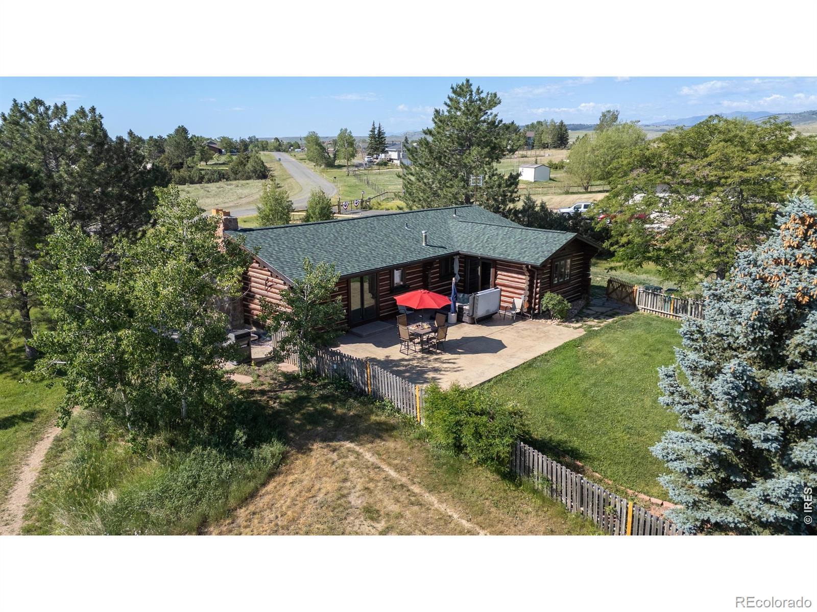 Image 3: Aerial view of the home, rear patio area, mature landscaping, and peaceful 2.41-acre setting. Image 3: Aerial view of the home, rear patio area, mature landscaping, and peaceful 2.41-acre setting.