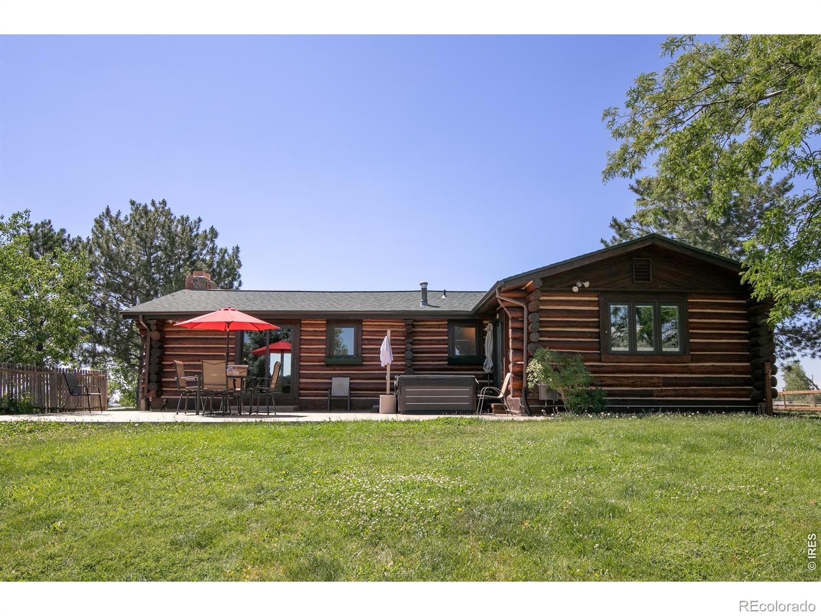 Image 4: Spacious backyard with custom log-home character, patio area, and room to relax while enjoying the surrounding views. Image 4: Spacious backyard with custom log-home character, patio area, and room to relax while enjoying the surrounding views.