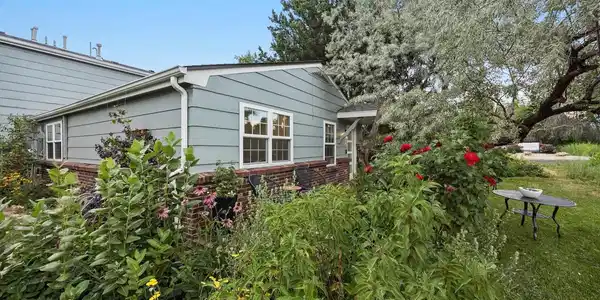 Image 2: Gorgeous flowers fill the gardens that surround your new home.