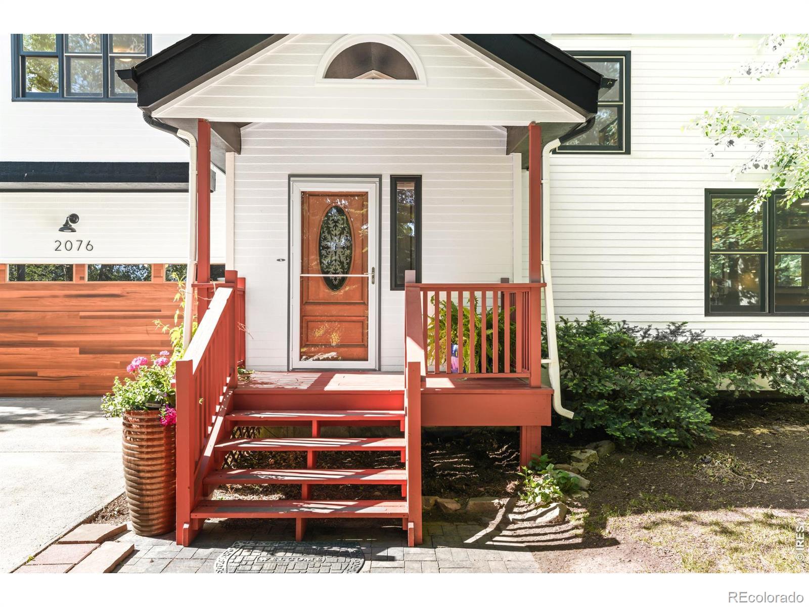Image 2: The front door has a small covered porch. Image 2: The front door has a small covered porch.