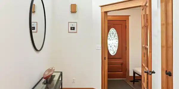 Image 3: The welcoming tiled entryway opens to a foyer with hardwood floors. Image 3: The welcoming tiled entryway opens to a foyer with hardwood floors.
