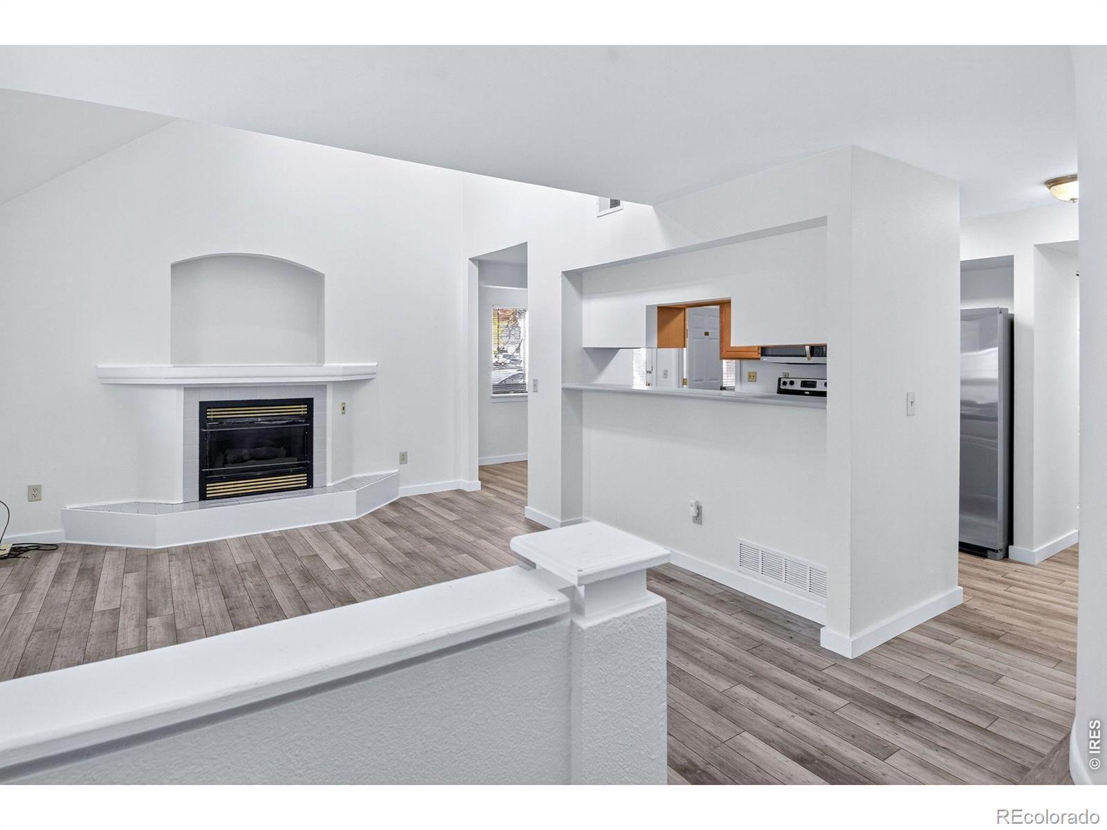 Image 4: Living Room w/ gas fireplace and updated flooring Image 4: Living Room w/ gas fireplace and updated flooring