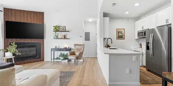 Image 2: This fully updated and modern home has soaring ceilings that fill the space with light.