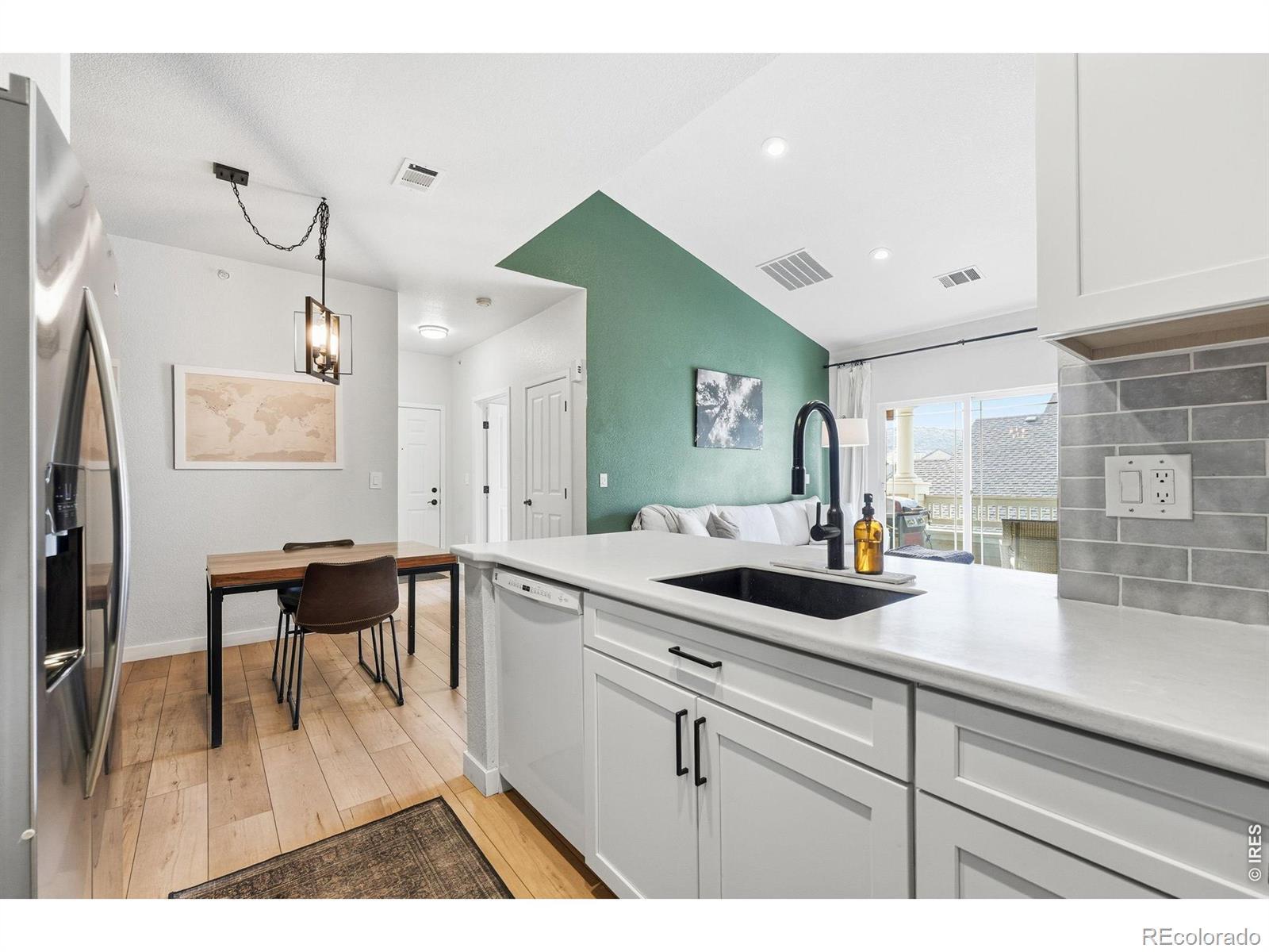 Image 3: The completely remodeled kitchen has had the bar height counter removed to increase working space and truly open it to the dining area and living room. Image 3: The completely remodeled kitchen has had the bar height counter removed to increase working space and truly open it to the dining area and living room.