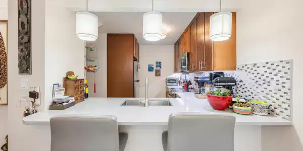 Image 4: Updated kitchen, custom tile backsplash, cherry cabinets, stainless steel appliances.