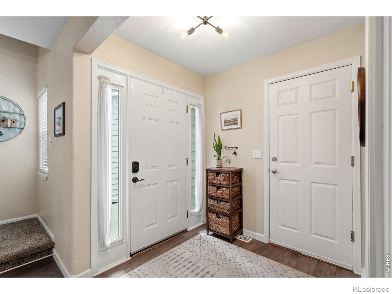 Image 3: Front entry - fresh paint throughout.