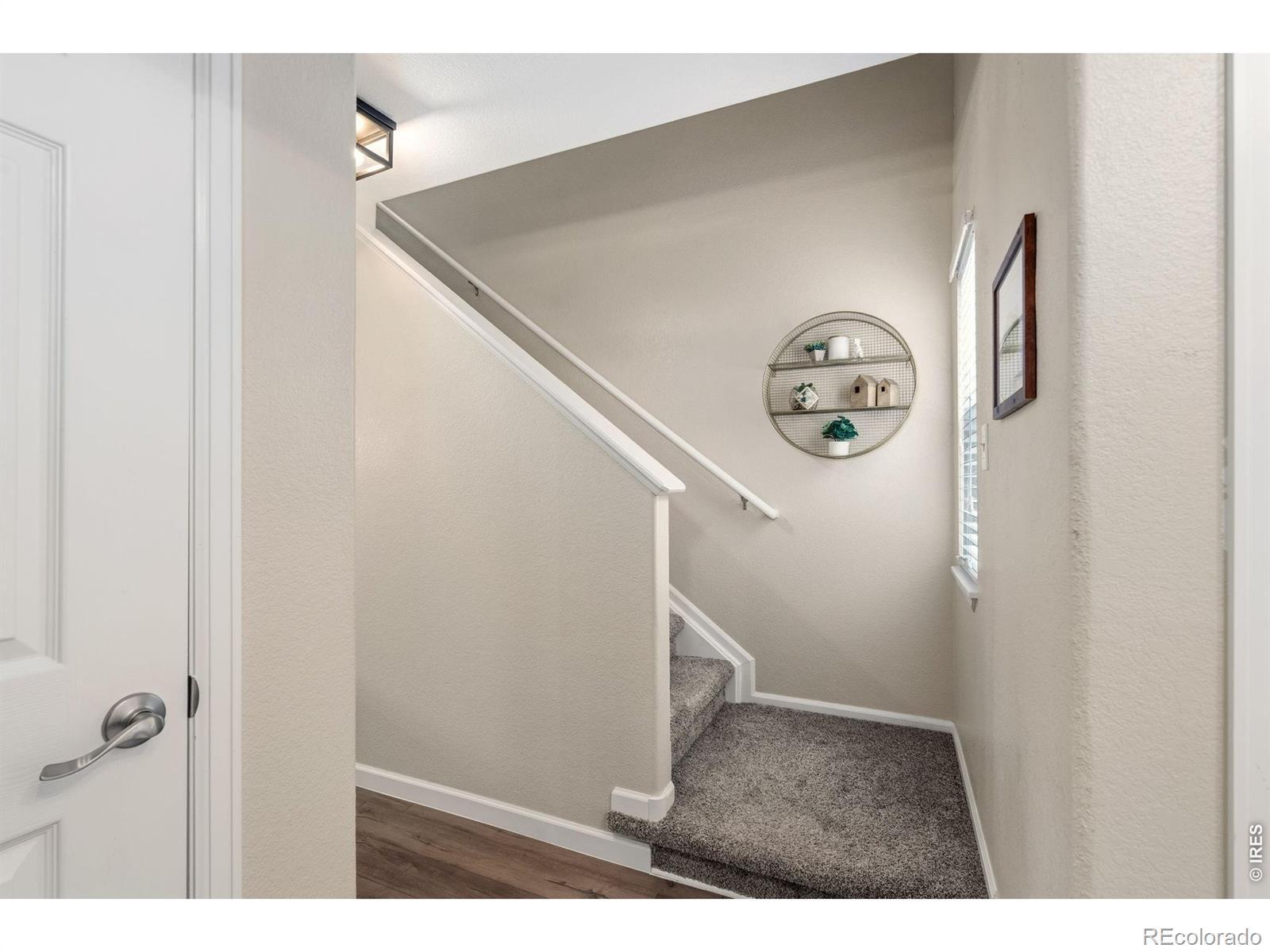 Image 4: Front entry - new flooring throughout.