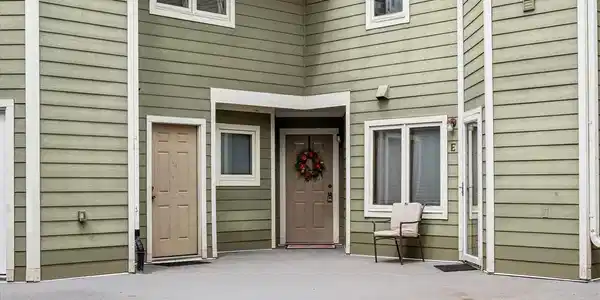 Image 4: Front door to 9-G has the wreath on the door. Image 4: Front door to 9-G has the wreath on the door.