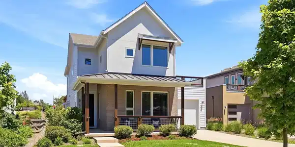 Image 3: Freshly painted, south-facing home with clean architectural lines and covered front porch.