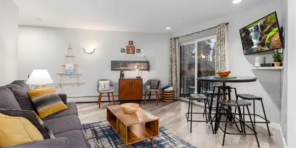 Image 3: An efficient and comfortable living and dining space, with a private deck to bring the outdoors in. Image 3: An efficient and comfortable living and dining space, with a private deck to bring the outdoors in.