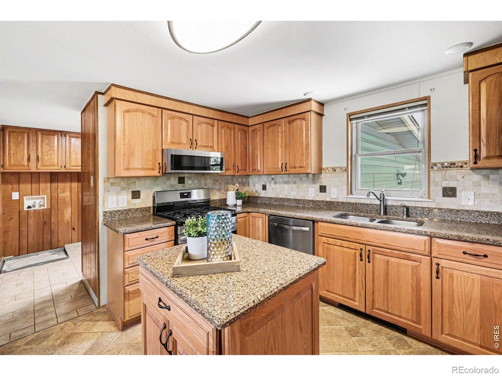 Image 3: After the mudroom, you will find your updated kitchen cabinets and countertops. Image 3: After the mudroom, you will find your updated kitchen cabinets and countertops.