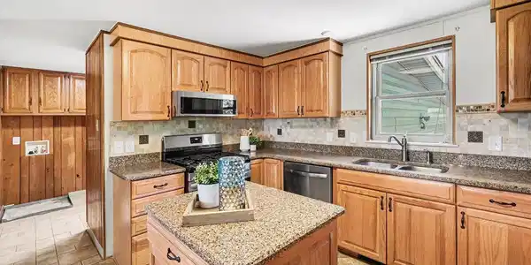 Image 3: After the mudroom, you will find your updated kitchen cabinets and countertops. Image 3: After the mudroom, you will find your updated kitchen cabinets and countertops.