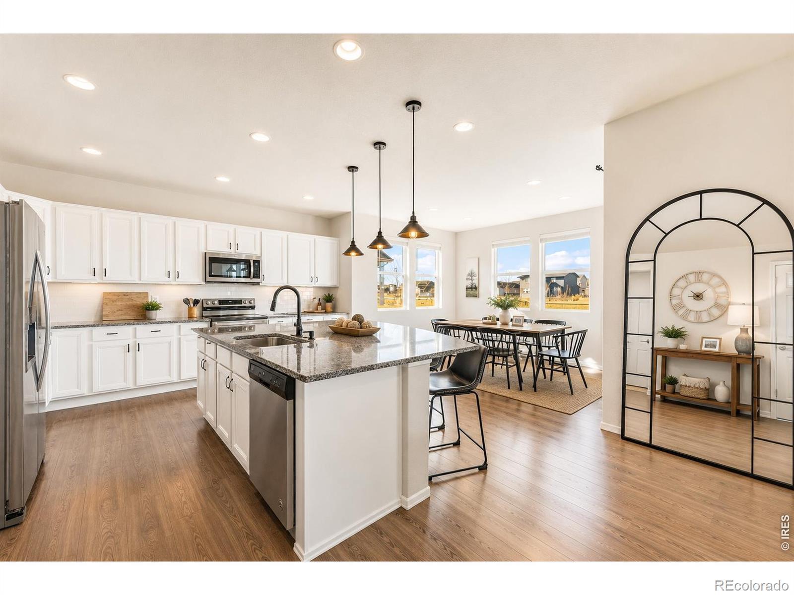 Image 4: Kitchen with stainless steel appliances and white cabinets Image 4: Kitchen with stainless steel appliances and white cabinets