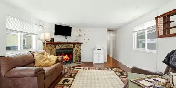 Image 2: Spacious Family Room w/ Fireplace (virtually touched) Image 2: Spacious Family Room w/ Fireplace (virtually touched)