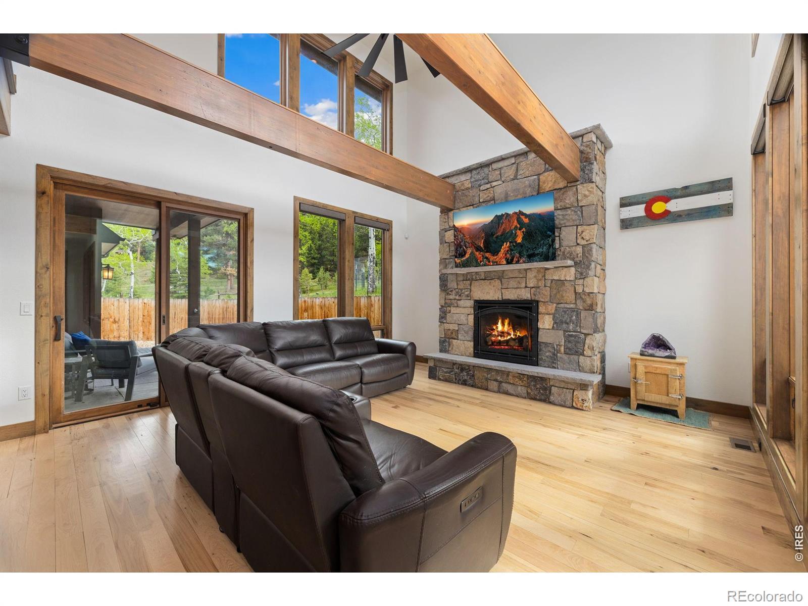 Image 4: This rock fireplace with flint stone mantel is the centerpiece of the great room Image 4: This rock fireplace with flint stone mantel is the centerpiece of the great room
