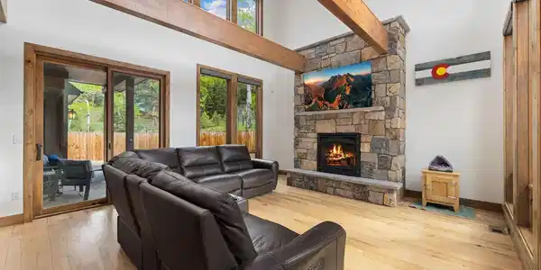 Image 4: This rock fireplace with flint stone mantel is the centerpiece of the great room Image 4: This rock fireplace with flint stone mantel is the centerpiece of the great room