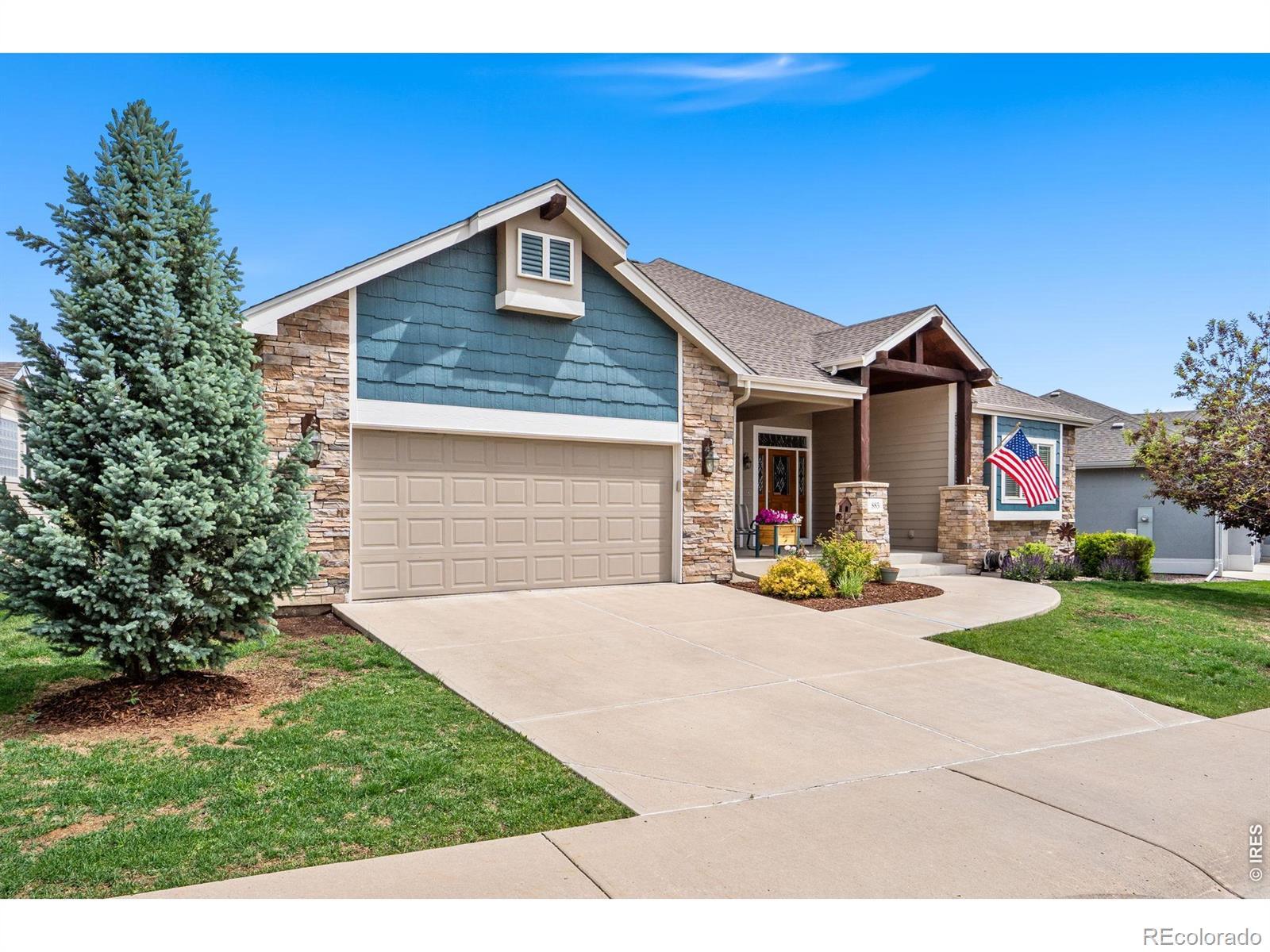 Image 2: home front showing attached 3-car tandem garage and front patio