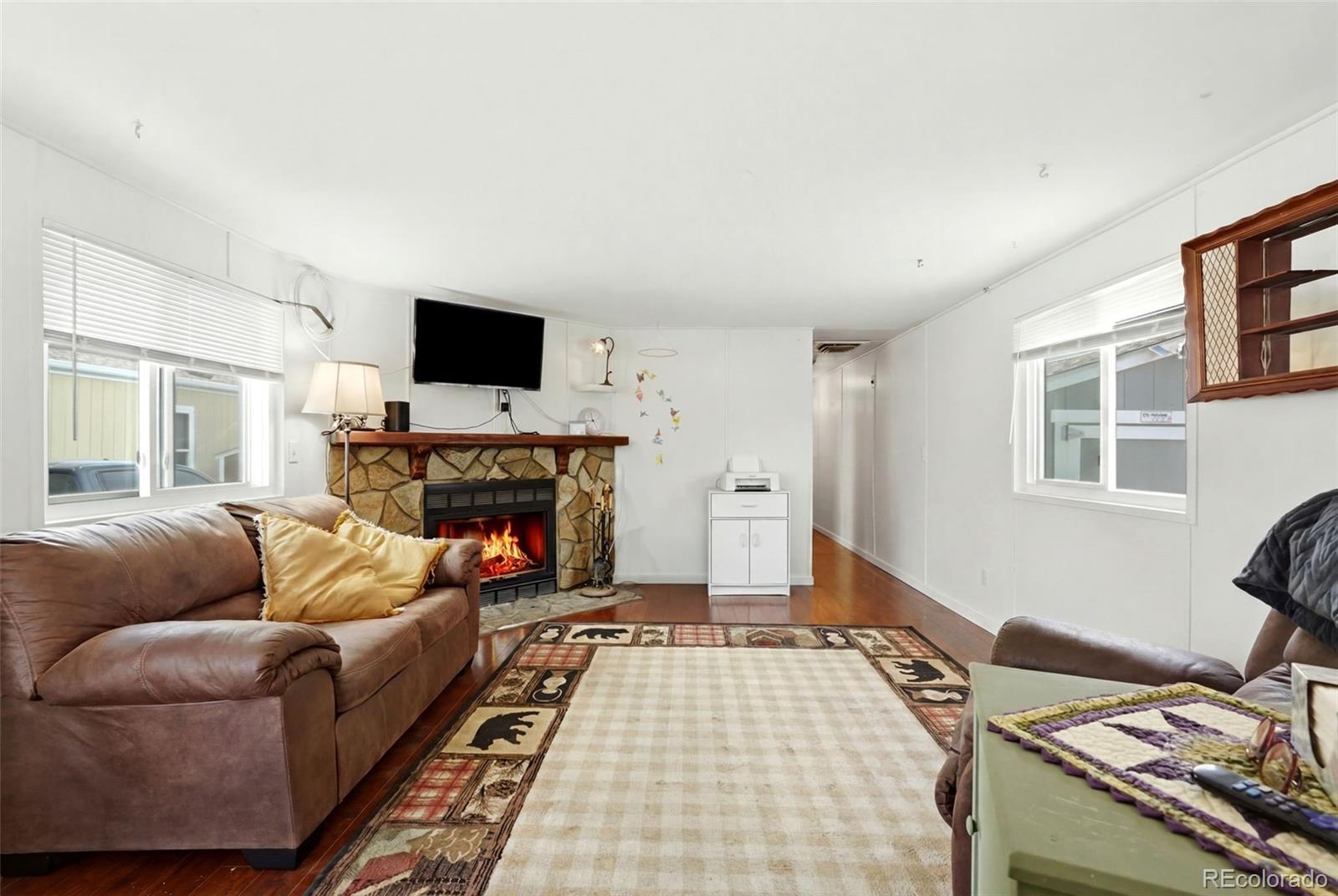 Image 2: Spacious Family Room w/ Fireplace (virtually touched) Image 2: Spacious Family Room w/ Fireplace (virtually touched)