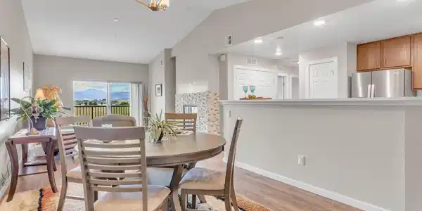 Image 4: Views for miles from the dining room through the family room out to the balcony where the mountains await! Image 4: Views for miles from the dining room through the family room out to the balcony where the mountains await!