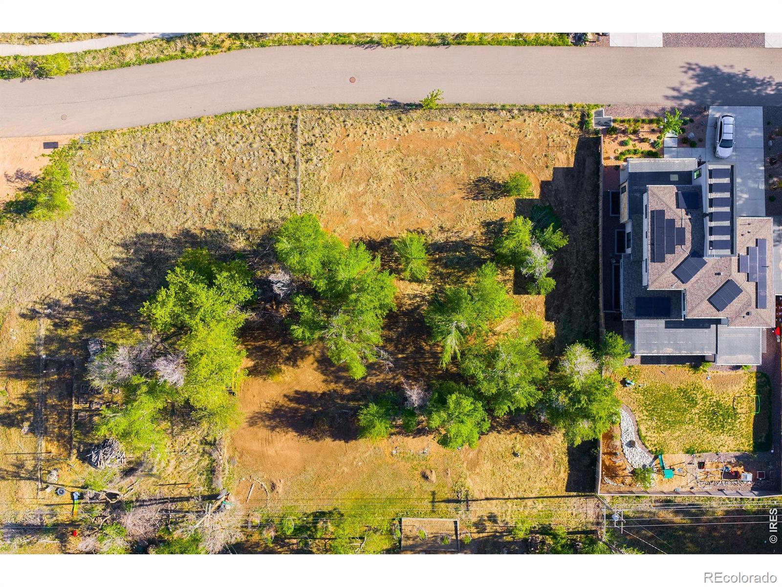 Image 2: This level lot provides flexibility for either a larger single-family residence or two smaller single-family homes, with existing city water and sewer connections already in place.