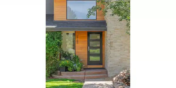 Image 3: a modern front door and warm wood accents provide a welcoming entrance Image 3: a modern front door and warm wood accents provide a welcoming entrance
