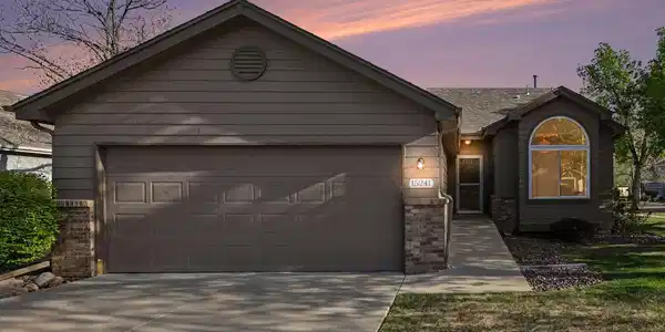 Image 2: Stunning twilight view of the homes exterior, highlighting the inviting entryway and warm outdoor lighting. Image 2: Stunning twilight view of the homes exterior, highlighting the inviting entryway and warm outdoor lighting.
